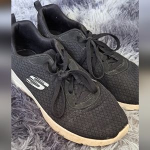 Black Sketchers breathable running shoes